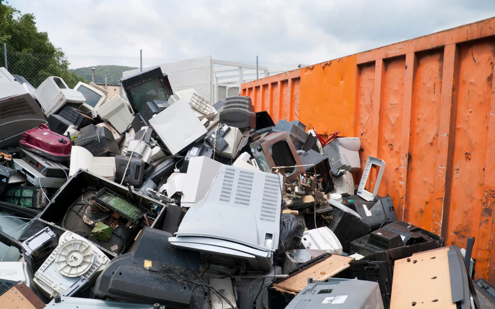 pile of e-waste in a container